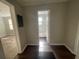Hallway view leading to a bathroom with a white tiled tub at 1440 Kenilworth Sw Dr, Atlanta, GA 30310