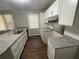 The kitchen features granite counters, stainless steel appliances, and ample cabinet space at 1440 Kenilworth Sw Dr, Atlanta, GA 30310