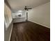 Spacious living room with wood floors and natural light, featuring an open-concept kitchen at 1440 Kenilworth Sw Dr, Atlanta, GA 30310