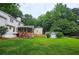 Large, lush backyard with a charming shed, fenced perimeter, and mature trees for privacy at 1885 Dayron Trce, Marietta, GA 30062