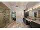 Modern bathroom features vanity, double sinks, decorative mirror, and shower at 1885 Dayron Trce, Marietta, GA 30062