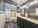 Elegant bathroom with double vanity, granite countertops, and a tiled shower/tub combo at 1885 Dayron Trce, Marietta, GA 30062