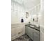 Well-lit powder room with stylish fixtures, mirror, and tile flooring at 1885 Dayron Trce, Marietta, GA 30062