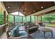 Spacious covered deck with vaulted ceiling, ceiling fans, and plenty of comfortable outdoor seating at 1885 Dayron Trce, Marietta, GA 30062
