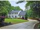 Beautiful two-story home with manicured lawn, mature landscaping, and a welcoming driveway at 1885 Dayron Trce, Marietta, GA 30062