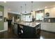 Kitchen island with built-in appliances, granite countertop, and custom storage at 1885 Dayron Trce, Marietta, GA 30062