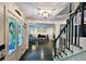 Open living room with hardwood floors, stairs, and views to a home office at 1885 Dayron Trce, Marietta, GA 30062