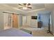 Large bedroom features a barn door entry to bathroom and closet at 1885 Dayron Trce, Marietta, GA 30062