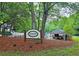 Piedmont Chase Swim and Tennis sign with pool area and trees in the background at 1885 Dayron Trce, Marietta, GA 30062