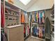 Bright walk-in closet with custom shelving and a skylight for natural illumination at 1885 Dayron Trce, Marietta, GA 30062