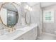 Bright bathroom with double vanity, floral wallpaper, and modern fixtures at 220 Foxley Way, Roswell, GA 30075