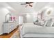 Bedroom features a trey ceiling, a large bed, and a dresser with decor at 220 Foxley Way, Roswell, GA 30075