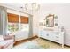 Elegant Bedroom with a dresser, changing table, hardwood floors, and natural light at 220 Foxley Way, Roswell, GA 30075