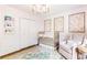 This is a charming Bedroom with pink patterned walls, white trim, and artwork at 220 Foxley Way, Roswell, GA 30075