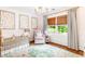 Charming Bedroom with crib, pink armchair, and natural light from the window at 220 Foxley Way, Roswell, GA 30075