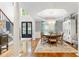 Elegant dining room with hardwood floors, designer chandelier, and an abundance of natural light at 220 Foxley Way, Roswell, GA 30075