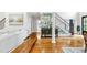 Beautiful foyer boasts hardwood floors, a staircase, stylish furnishings, and tasteful decor at 220 Foxley Way, Roswell, GA 30075