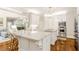 Gourmet kitchen features a spacious center island, stainless steel appliances, and modern white cabinetry at 220 Foxley Way, Roswell, GA 30075
