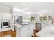 Bright kitchen features a center island, stainless steel appliances, and stylish fixtures at 220 Foxley Way, Roswell, GA 30075