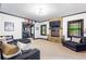 Living room with stone fireplace, TV, sofa, and view of the bar area at 220 Foxley Way, Roswell, GA 30075