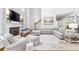 Spacious living room with hardwood floors, lots of natural light, a fireplace and modern furnishings at 220 Foxley Way, Roswell, GA 30075