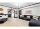 Comfortable living room with a large sectional sofa, open to home bar and decor at 220 Foxley Way, Roswell, GA 30075