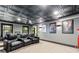 Home movie theater with comfortable seating, projector, movie posters, and carpeted floors at 220 Foxley Way, Roswell, GA 30075