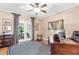 Bright office with decorative wallpaper, built-ins, neutral rug and French doors to a patio area at 220 Foxley Way, Roswell, GA 30075