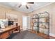 Home office features a desk, hardwood floors, shelving, and modern decor at 220 Foxley Way, Roswell, GA 30075