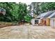 Backyard with basketball hoop, patio and lush green backyard at 2244 Deer Ridge Dr, Tucker, GA 30087
