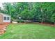 Spacious backyard with patio, playground area, and lush landscaping at 2244 Deer Ridge Dr, Tucker, GA 30087