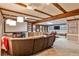 Finished basement with projector, large sectional couch, kitchenette, and seating at 2244 Deer Ridge Dr, Tucker, GA 30087
