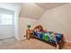Cozy bedroom with a sloped ceiling, carpeting and ample natural light at 2244 Deer Ridge Dr, Tucker, GA 30087