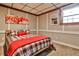 Cozy bedroom featuring a bed, carpet, and a window with natural light at 2244 Deer Ridge Dr, Tucker, GA 30087
