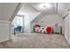 Bedroom featuring a sloped ceiling, dormer window, a desk, and neutral carpeting at 2244 Deer Ridge Dr, Tucker, GA 30087