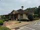 Charming clubhouse featuring stone accents, lush landscaping, and a covered patio at 2244 Deer Ridge Dr, Tucker, GA 30087
