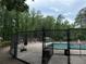 Community pool with lounge chairs and a boardwalk, ideal for relaxation and summer fun at 2244 Deer Ridge Dr, Tucker, GA 30087