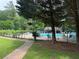A charming community pool with lounge chairs, inviting residents to relax and enjoy the water at 2244 Deer Ridge Dr, Tucker, GA 30087
