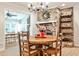 Eat in dining area with brick fireplace and built in shelving at 2244 Deer Ridge Dr, Tucker, GA 30087