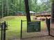 Community dog park featuring play equipment and rules, designed for canine enjoyment at 2244 Deer Ridge Dr, Tucker, GA 30087