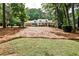 Beautifully landscaped front yard and exterior view of this lovely brick home with dormer windows and covered porch at 2244 Deer Ridge Dr, Tucker, GA 30087