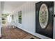 Inviting front porch with rocking chairs and a decorative front door, creating a warm and welcoming entrance at 2244 Deer Ridge Dr, Tucker, GA 30087