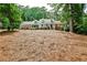 Charming brick home with a welcoming front porch, lush trees, and well-maintained lawn at 2244 Deer Ridge Dr, Tucker, GA 30087