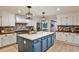 Renovated kitchen with white cabinetry, stainless steel appliances and a center island at 2244 Deer Ridge Dr, Tucker, GA 30087