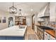 Spacious kitchen with large island, stainless steel appliances, and designer backsplash at 2244 Deer Ridge Dr, Tucker, GA 30087