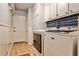 Convenient laundry room with ample storage, modern washer and dryer, and a door to the outside at 2244 Deer Ridge Dr, Tucker, GA 30087