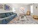 Cozy living room with hardwood floors, comfortable seating, and staircase access, perfect for relaxation and gatherings at 2244 Deer Ridge Dr, Tucker, GA 30087