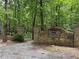 Scenic entrance to Probst Park features a stone structure and lush greenery at 2244 Deer Ridge Dr, Tucker, GA 30087