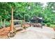 Outdoor patio features a swing and pergola, perfect for relaxing and entertaining in this serene backyard space at 2244 Deer Ridge Dr, Tucker, GA 30087