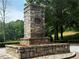 Elegant stone monument with flowers, nestled in green surroundings at 2244 Deer Ridge Dr, Tucker, GA 30087